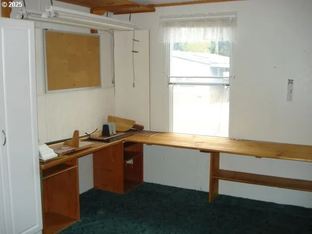 a kitchen with granite countertop a sink and a stove