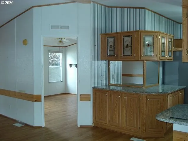 a view of a door and wooden floor