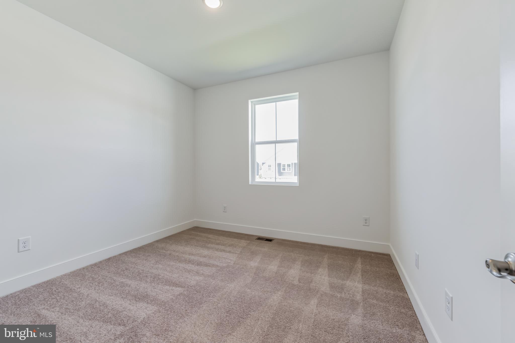 36319 Gate Drive Georgetown, DE 19947 - Photo 15 of 28 an empty room with a window