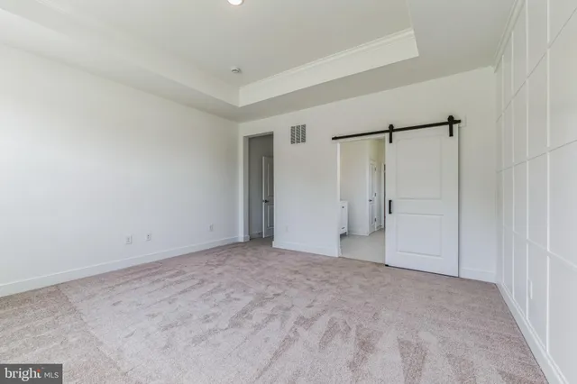 a bathroom with a granite countertop sink two mirror and a shower