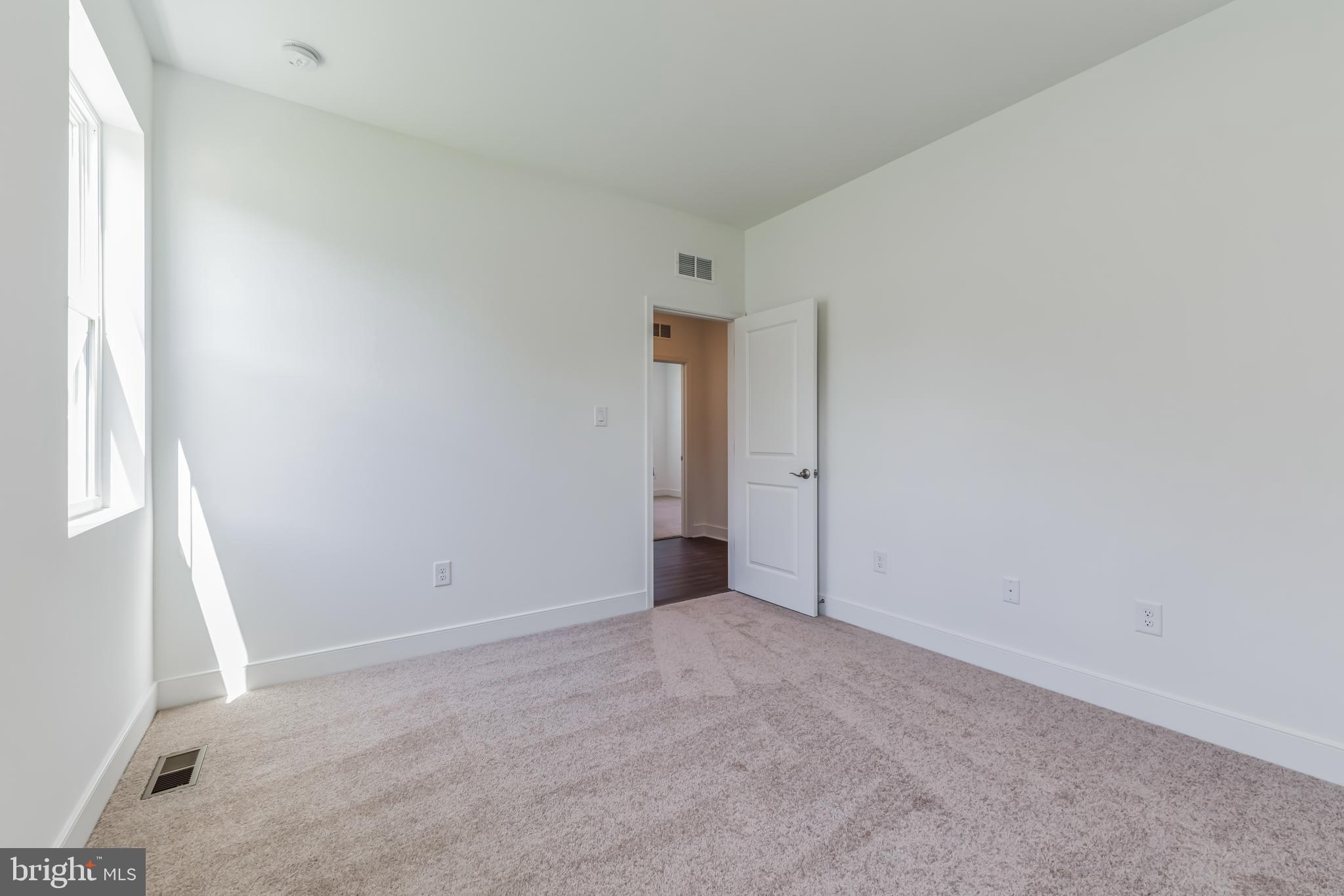 36319 Gate Drive Georgetown, DE 19947 - Photo 9 of 28 an empty room with an entryway