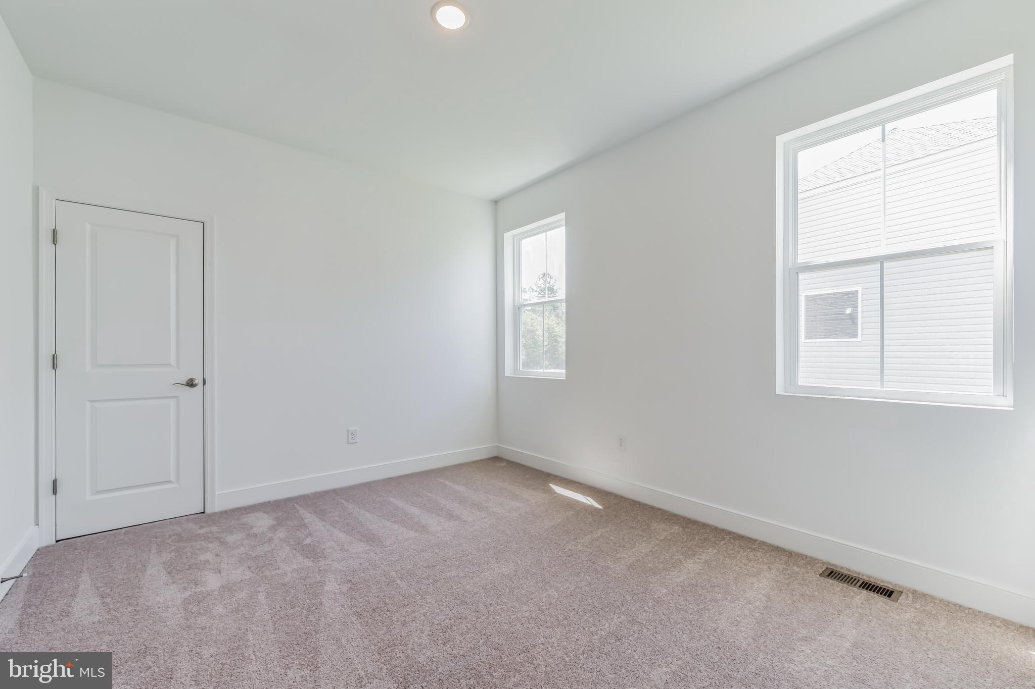 36319 Gate Drive Georgetown, DE 19947 - Photo 10 of 28 an empty room with windows