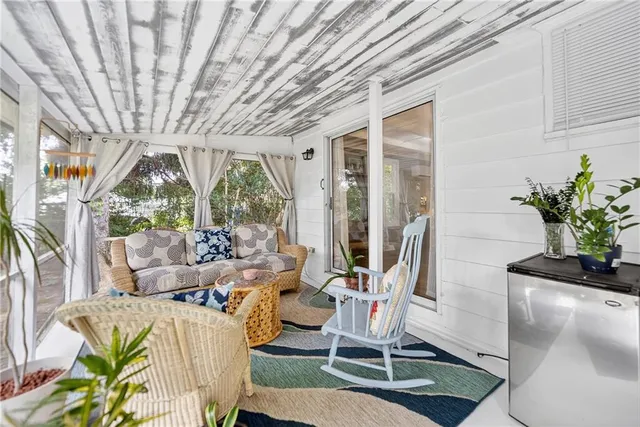 a living room with patio furniture