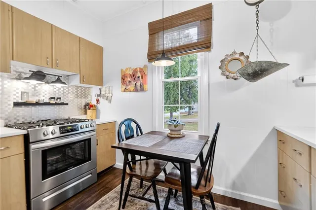 a kitchen with a stove a sink and a stove