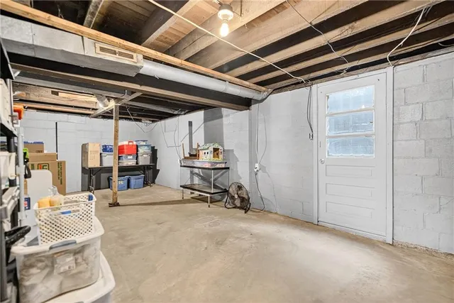 a view of backyard of house with green space