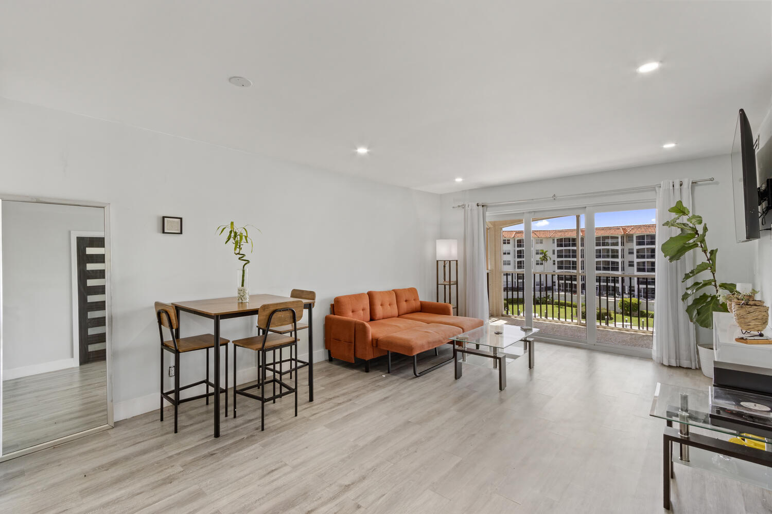 2871 North Ocean Boulevard, Unit V443 Boca Raton, FL 33431 - Photo 17 of 49 a living room with furniture and wooden floor