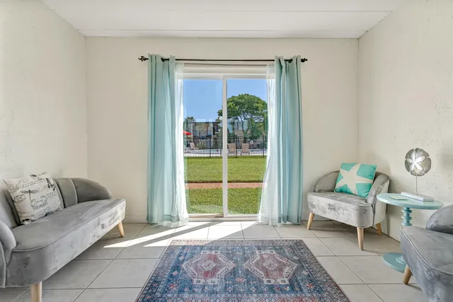 a living room with furniture and a window