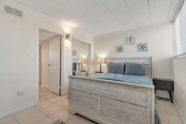 a bedroom with a bed and a cabinets