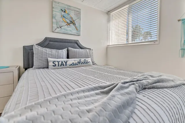a bedroom with a bed and a cabinets