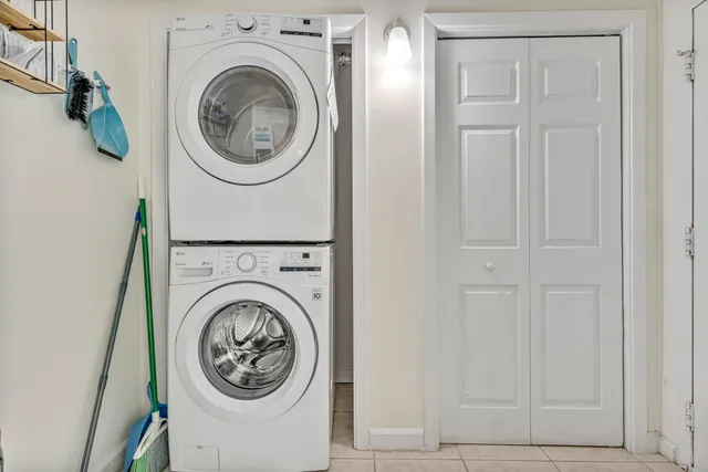 an aerial view of a house with a yard and lake view