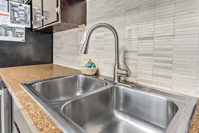 a view of a house with a yard and garage