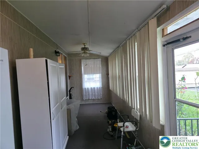 a bedroom with a bed and dresser