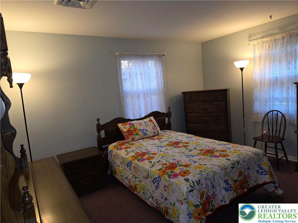 127 East Lynnwood Street Allentown, PA 18103 - Photo 21 of 34 a bedroom with a bed and wooden floor
