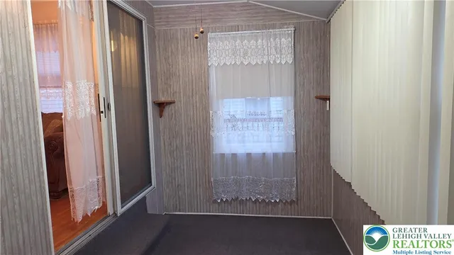 a view of front door with wooden floor