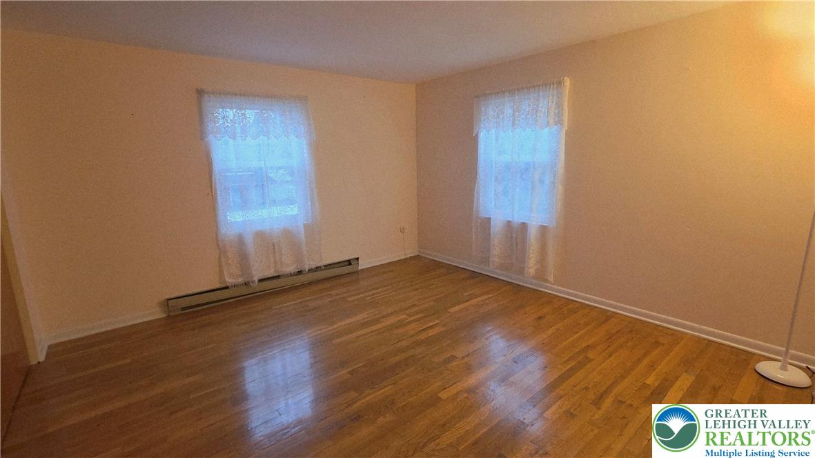 127 East Lynnwood Street Allentown, PA 18103 - Photo 31 of 34 an empty room with wooden floor and windows