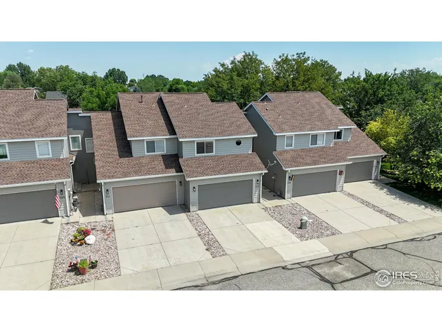 a aerial view of a house with a yard
