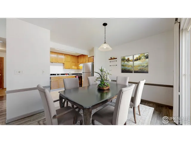 a kitchen with a table and chairs in it