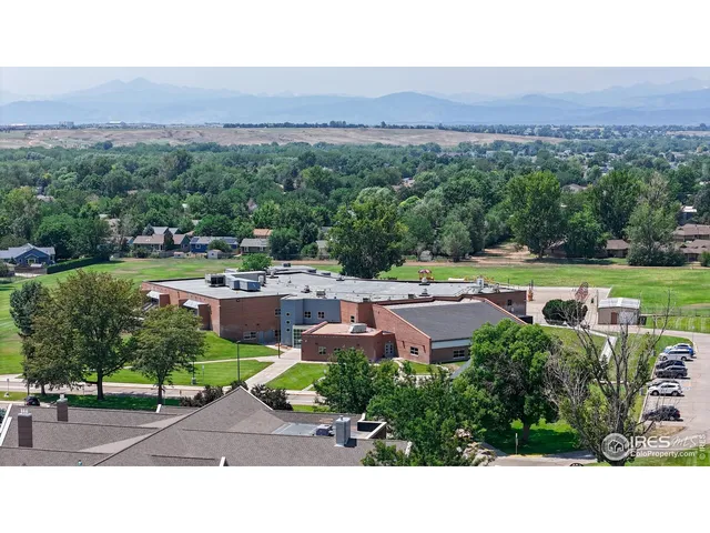 a aerial view of a house with outdoor space and street view