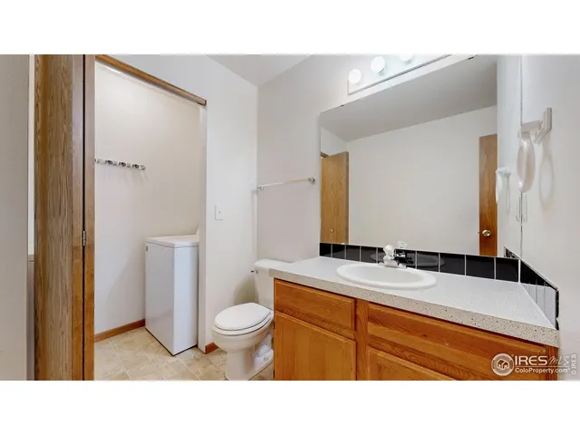 a kitchen with stainless steel appliances granite countertop a refrigerator and a stove