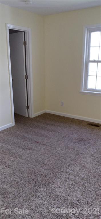 127 Wildcat Road, Unit C Lancaster, SC 29720 - Photo 11 of 15 an empty room with windows and closet
