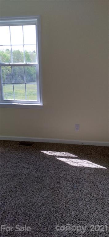 127 Wildcat Road, Unit C Lancaster, SC 29720 - Photo 13 of 15 a view of an empty room with a window