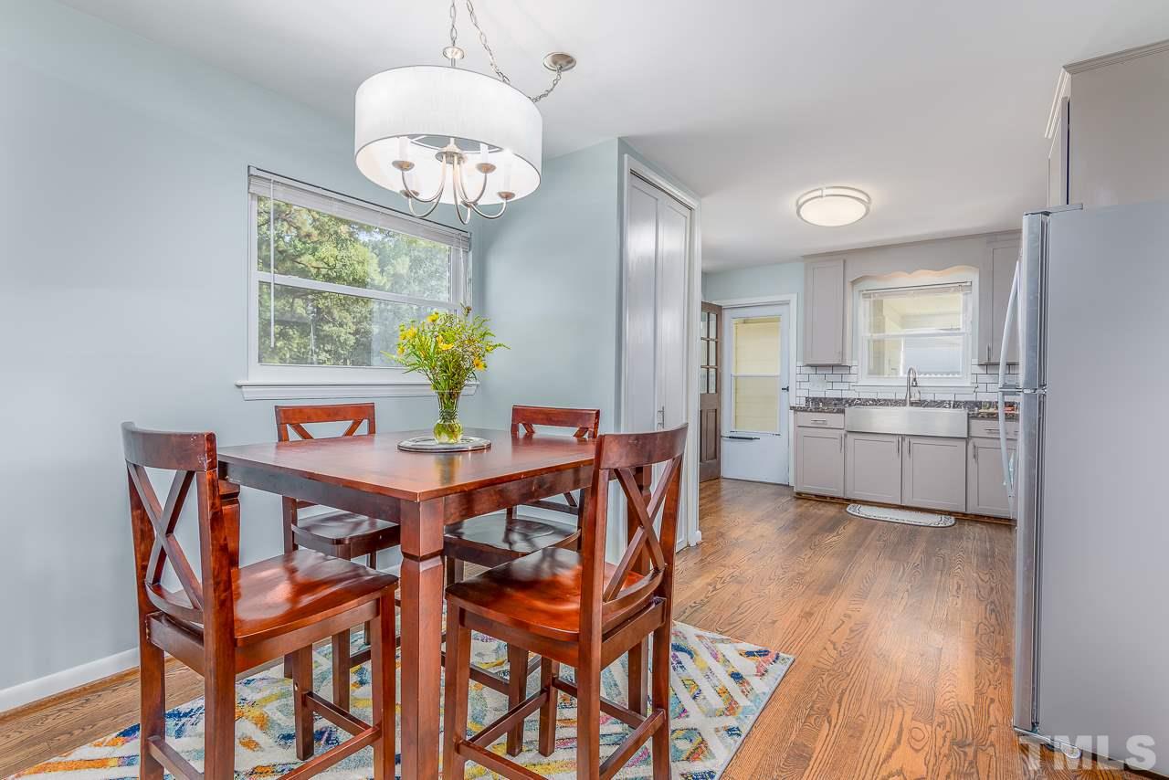 4105 Suitt Road Durham, NC 27703 - Photo 4 of 15 a dining room with furniture and chandelier