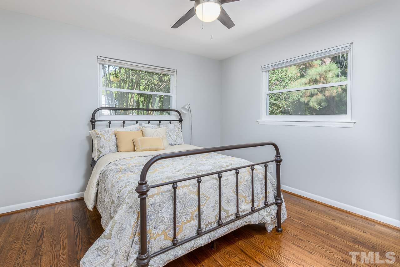 4105 Suitt Road Durham, NC 27703 - Photo 8 of 15 a bedroom with a bed and a window