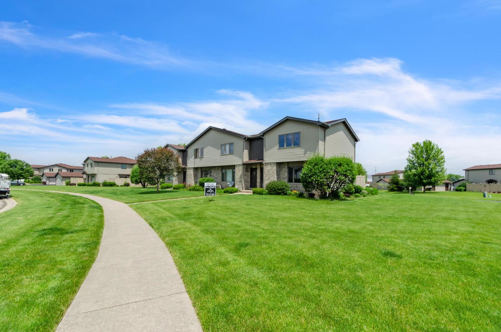 722 Sojourn Road New Lenox, IL 60451 - Photo 3 of 23 a view of a green field with house in the background