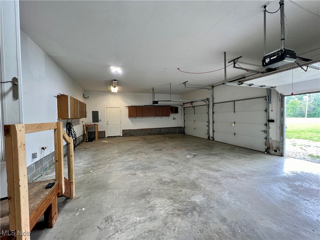 48632 Garfield Road Oberlin, OH 44074 - Photo 36 of 36 Garage and a garage door opener