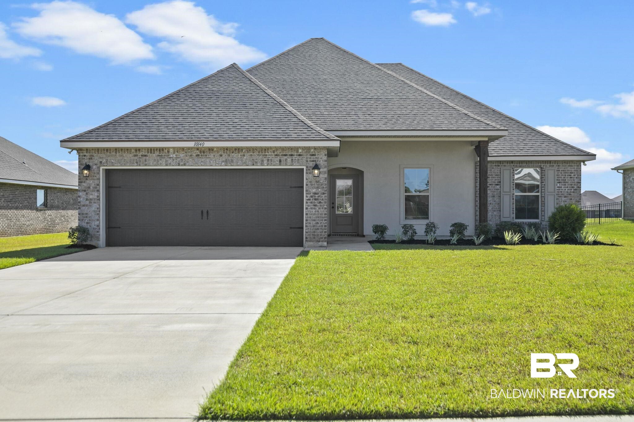 10140 Chipper Lane Foley, AL 36535 - Photo 1 of 72 View of front facade with a front lawn and a garage