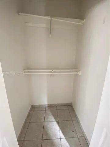 a view of an empty walk in closet