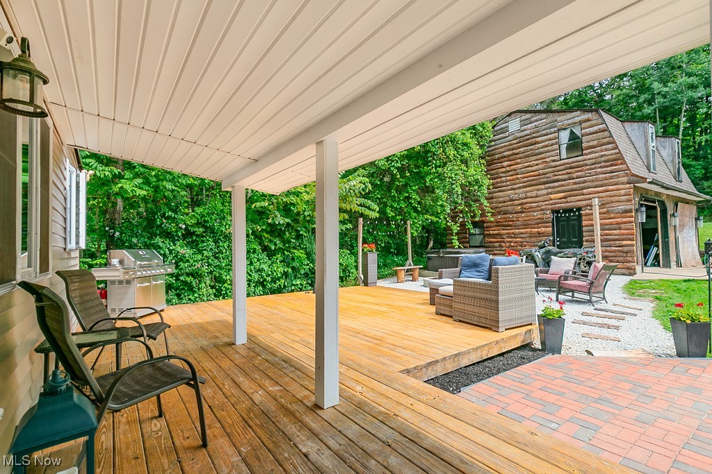 9723 Thwing Road Chardon, OH 44024 - Photo 37 of 42 Wooden terrace featuring an outdoor living space and grilling area