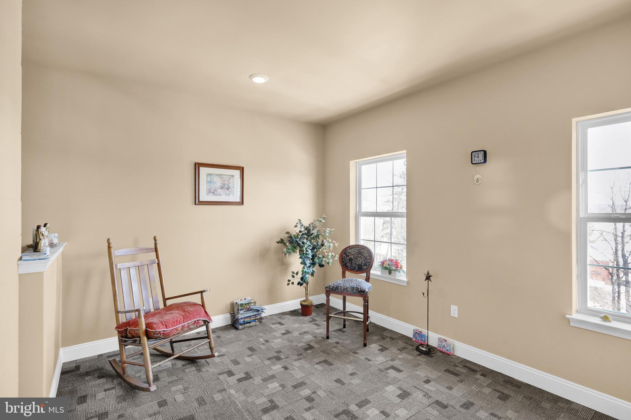 79 Legacy Boulevard, Unit 306 Sinking Spring, PA 19608 - Photo 7 of 9 a living room with furniture and a window