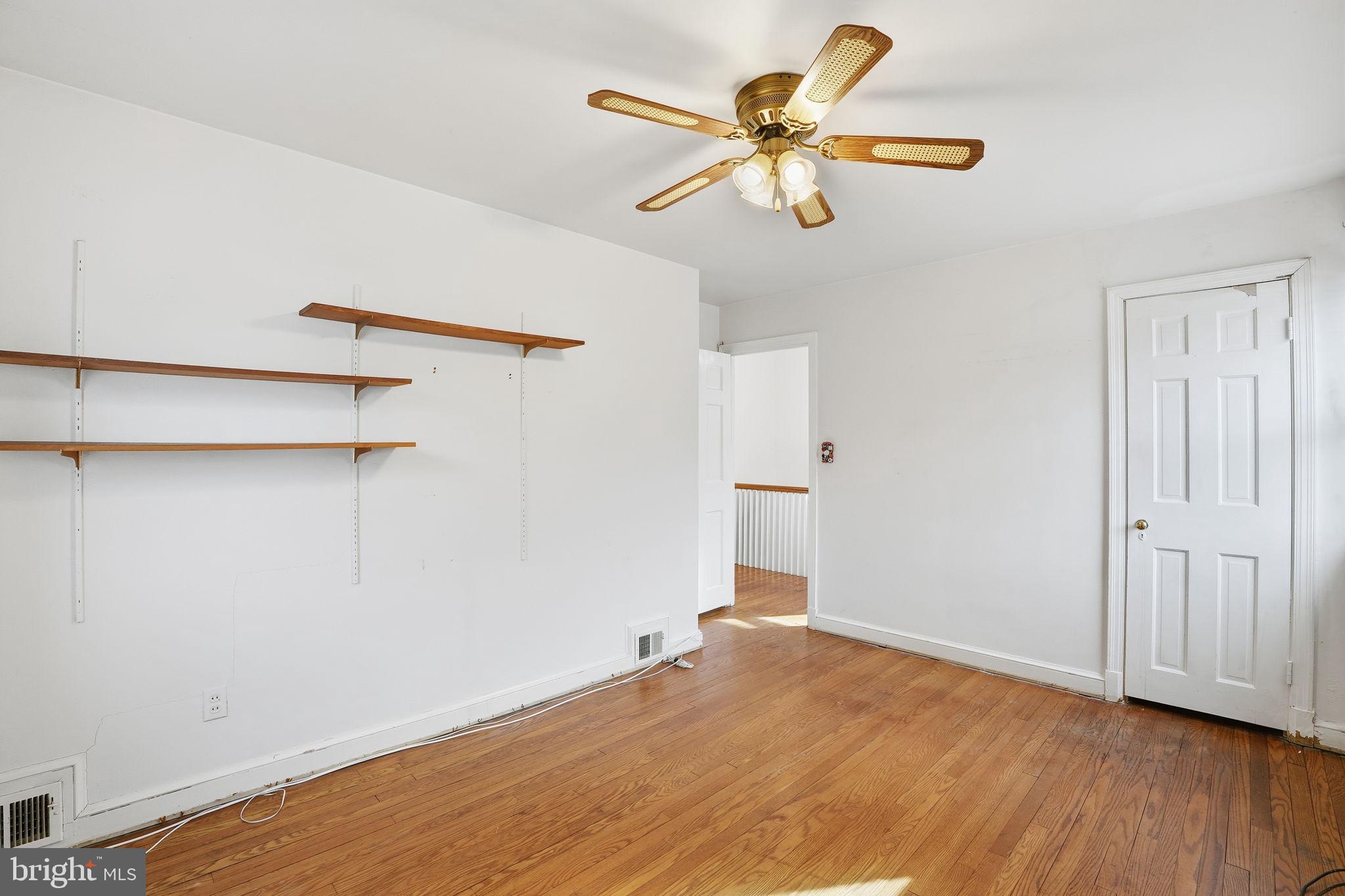 6758 Eastern Avenue Northwest Washington, DC 20012 - Photo 15 of 35 a view of a room with wooden floor and a ceiling fan