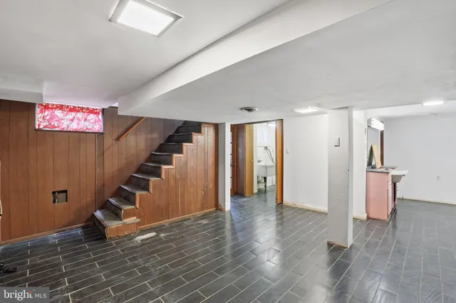 a view of an entryway with wooden floor and stairs