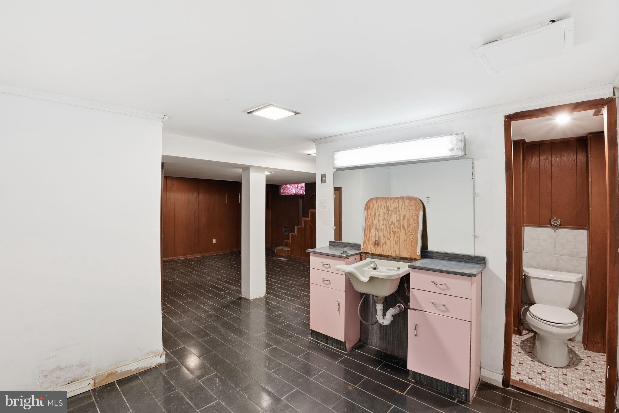 6758 Eastern Avenue Northwest Washington, DC 20012 - Photo 26 of 35 a living room with furniture and a toilet