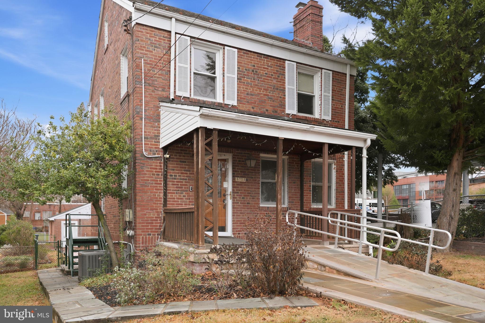6758 Eastern Avenue Northwest Washington, DC 20012 - Photo 31 of 35 front view of a house with a small yard