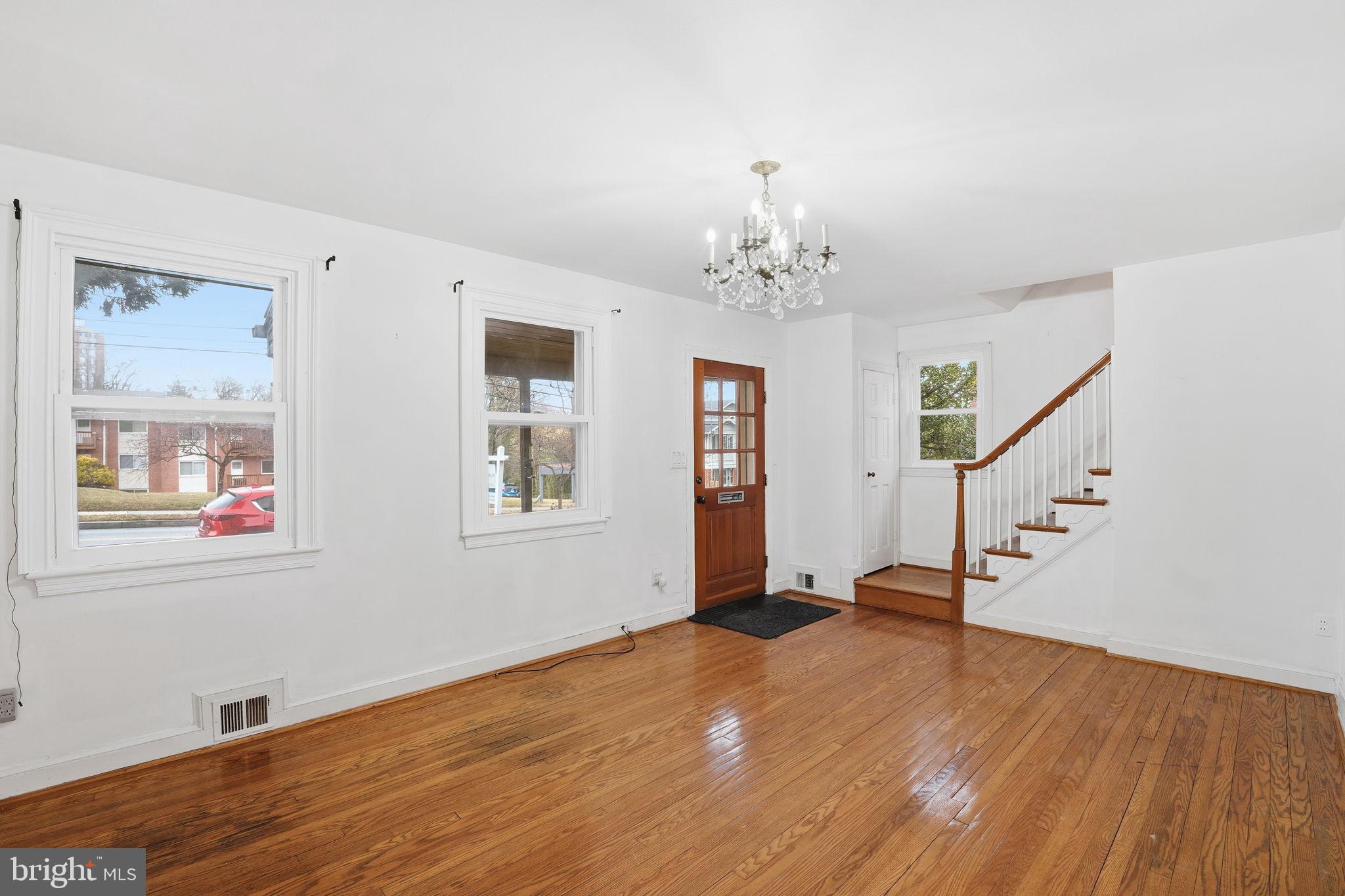 6758 Eastern Avenue Northwest Washington, DC 20012 - Photo 5 of 35 a view of empty room with wooden floor and fan