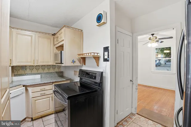a kitchen with a sink cabinets and appliances
