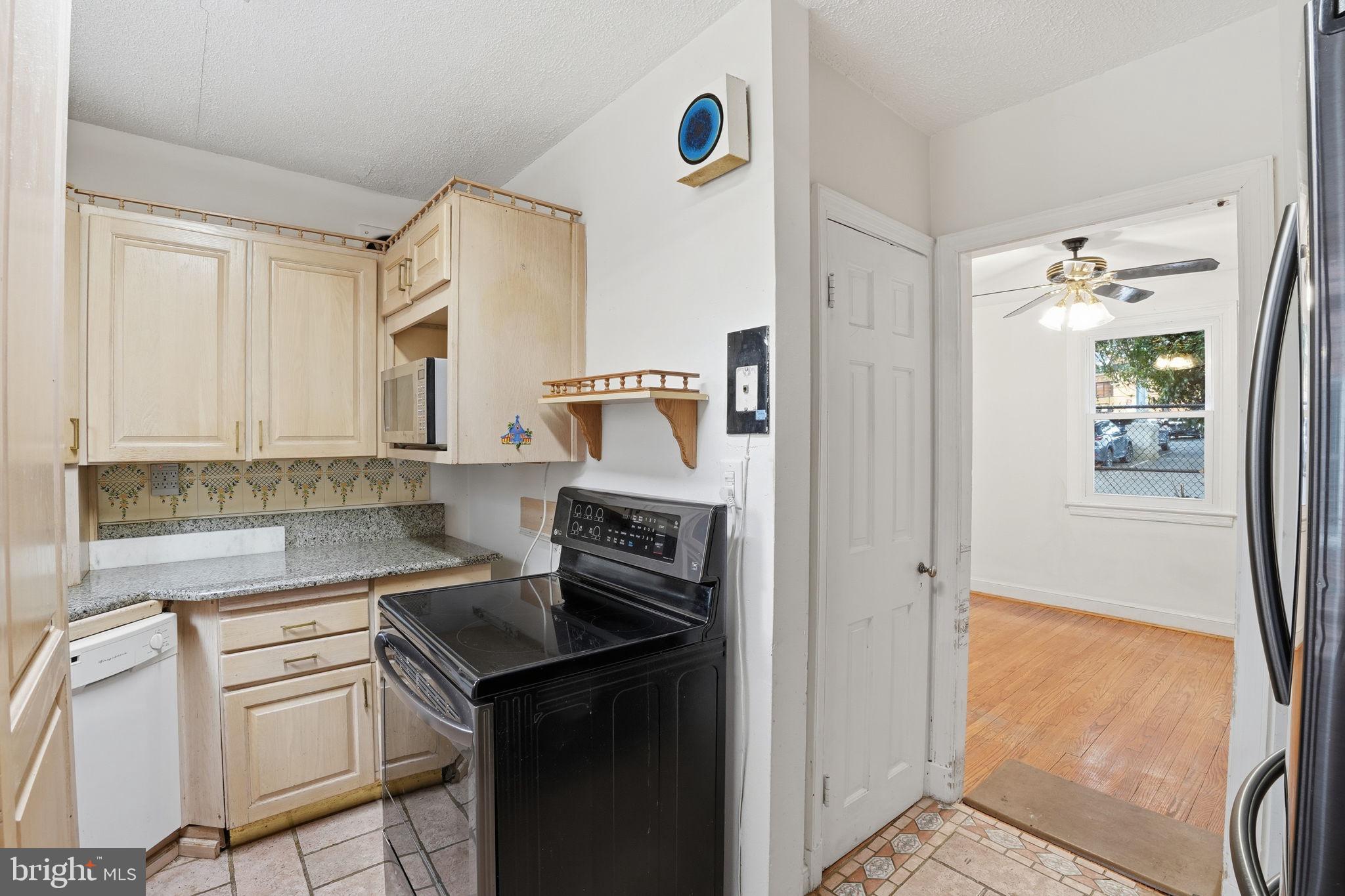 6758 Eastern Avenue Northwest Washington, DC 20012 - Photo 10 of 35 a kitchen with a sink cabinets and appliances