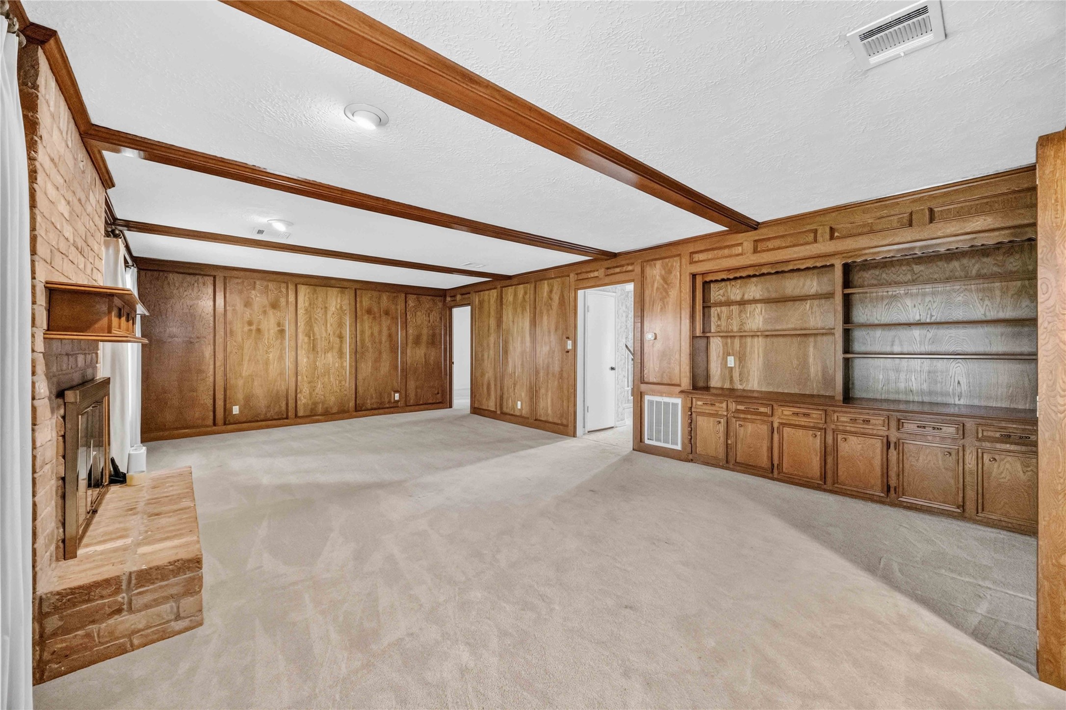 6302 Meadowtrace Drive Spring, TX 77389 - Photo 11 of 35 Large family room offers plenty of space for multiple seating areas and features extensive built-ins and a gas fireplace.