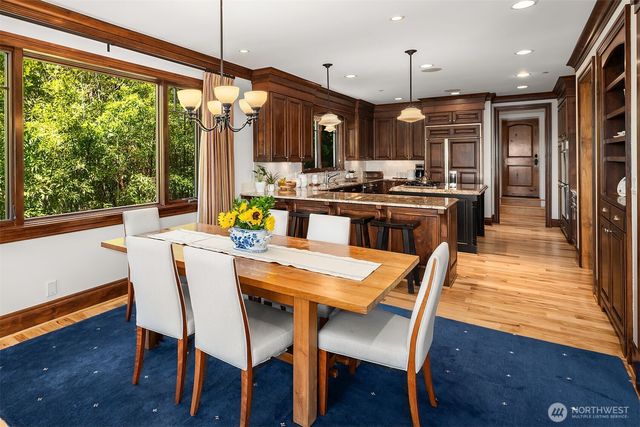a large kitchen with a table and chairs