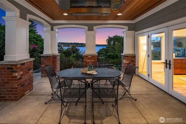 a view of a dining table and chairs in the patio