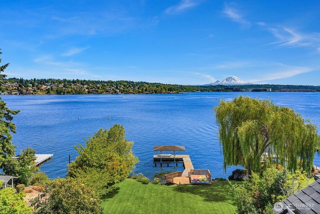 an aerial view of a house with a lake view