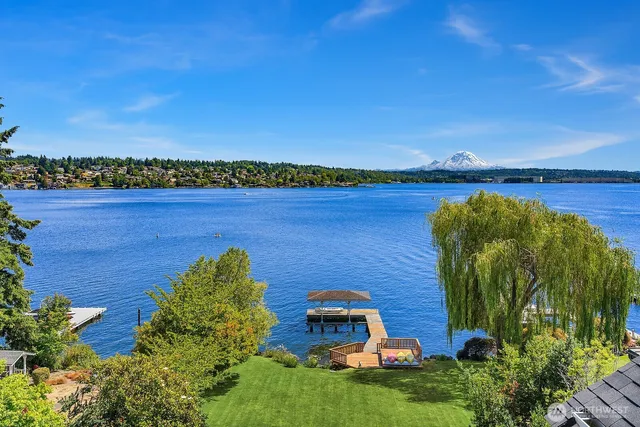 an aerial view of a house with a lake view