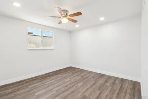 a dining room with furniture and a floor to ceiling window