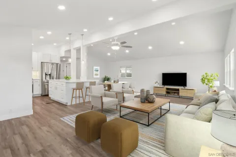 a living room with furniture wooden floor and a flat screen tv