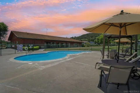 a view of a swimming pool with a patio