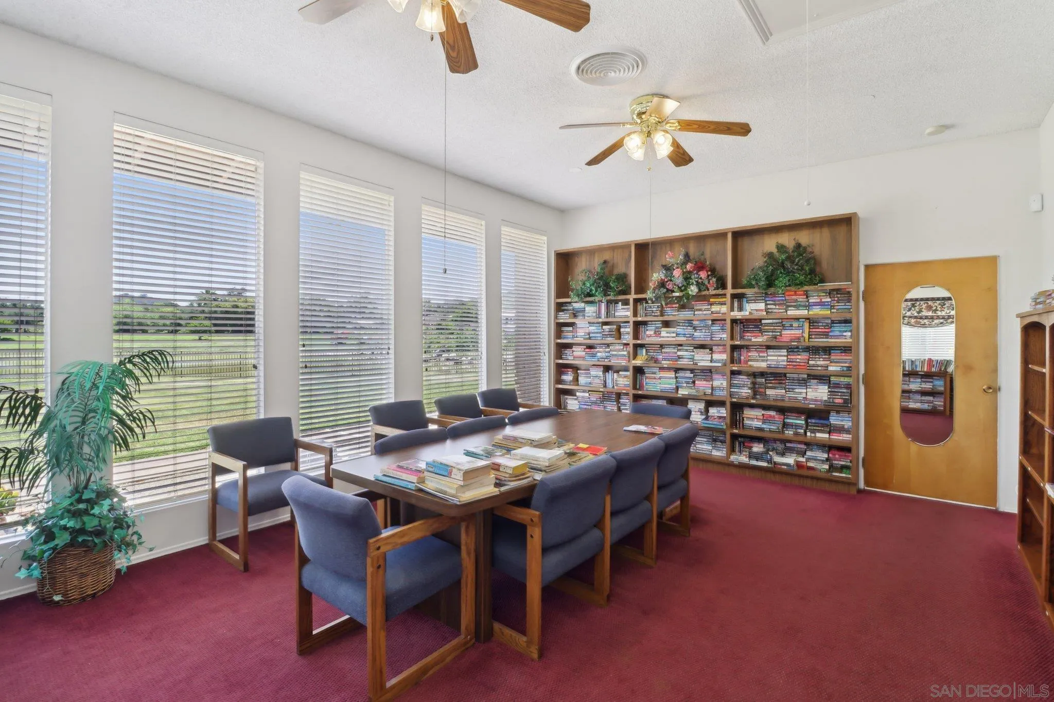 28890 Lilac Road, Unit 97 Valley Center, CA 92082 - Photo 32 of 51 a dining room with furniture and a floor to ceiling window