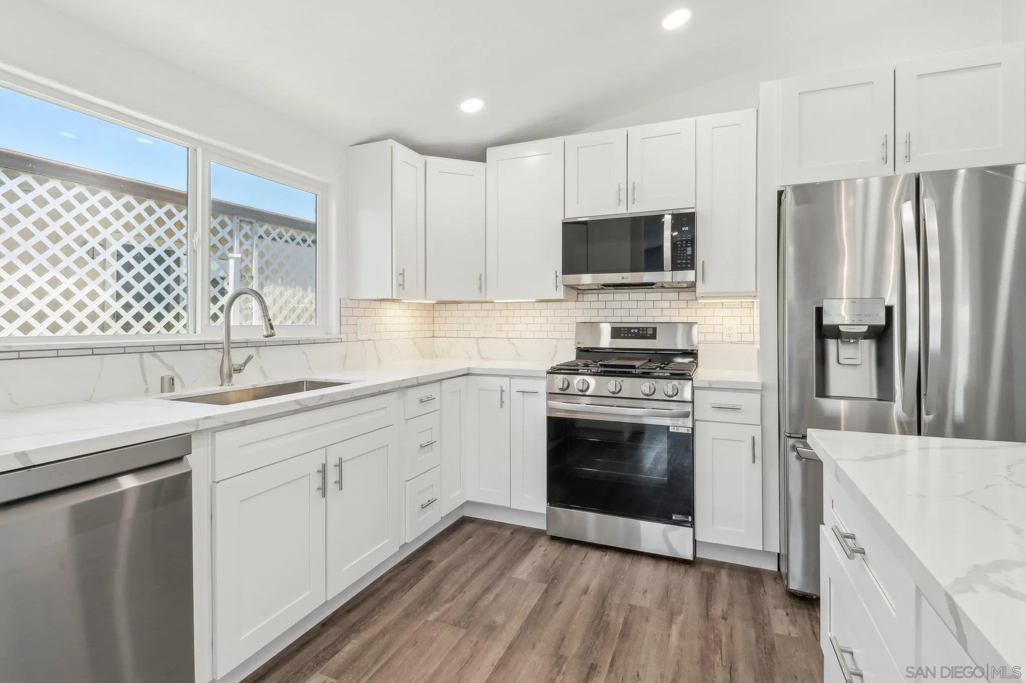 28890 Lilac Road, Unit 97 Valley Center, CA 92082 - Photo 7 of 51 a kitchen with a sink stove and refrigerator